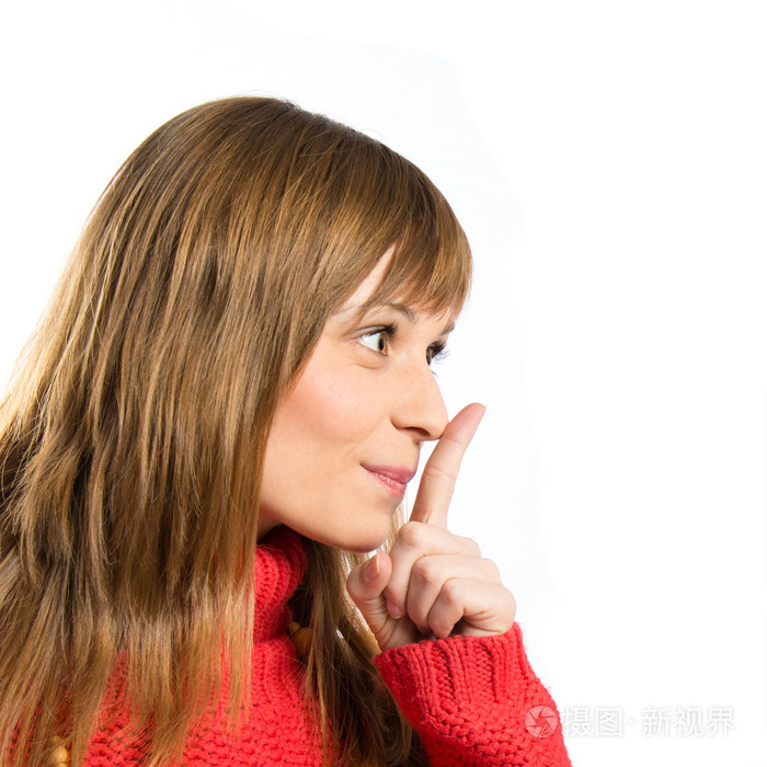 年轻的女孩做沉默的手势孤立的白色背景