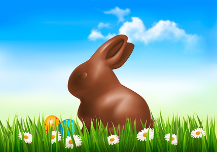 巧克力做的复活节彩蛋在草丛中的兔子。矢量