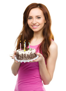 周年纪念蛋糕的年轻女子图片
