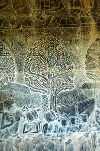 在走廊的柬埔寨吴哥窟雕塑的墙图片