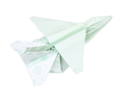 Origami flygplan isolerad p vit