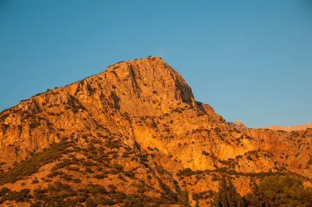 Turecko, Oludeniz pi zpadu slunce na pozad modr oblohy