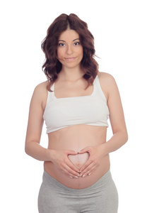 怀孕的女人，在她的肚子上形成一颗心