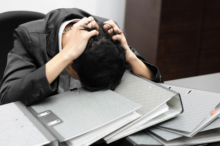 在工作周到或压力大商人照片