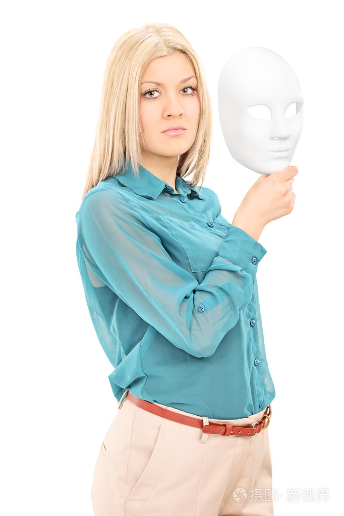 年轻的女演员举行戏剧面具
