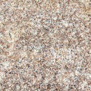 抛光的白米和糙米粒花岗岩作为背景