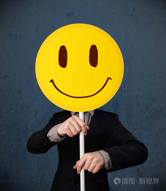 商人持有一个面带笑容的脸图释