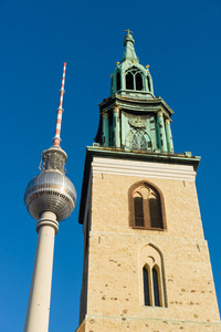 s Church Marienkirche and the Berlin TV tower against the blue