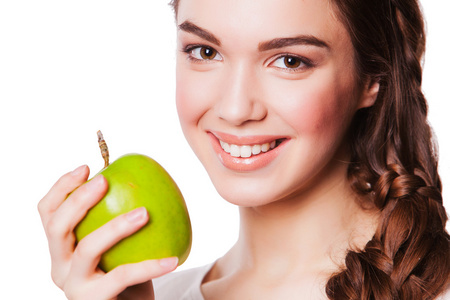 健康的女人，与绿色的苹果。白色衬底上分离