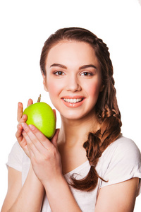 青苹果一个年轻女人的照片。健康饮食概念