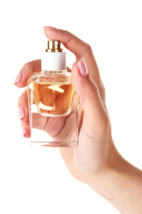 瓶香水在孤立的白色衬底上的手