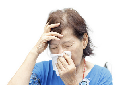 亚洲高级妇女患有头痛和冷照片