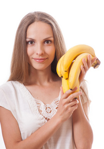 年轻的女孩举行香蕉