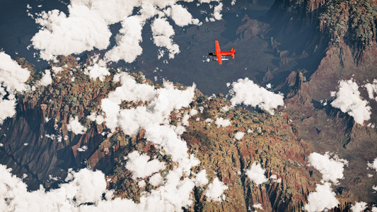 飞机飞过岩石干风景和云。空中拍摄