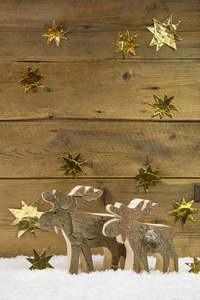 两个木制麋鹿木制圣诞背景