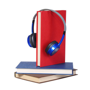 有声读物的概念。耳机和孤立的书