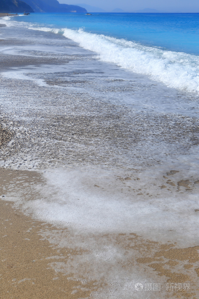 海边波浪对砂的美丽背景
