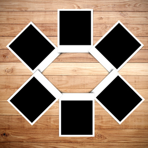 拍立得相框木背景上摄影图