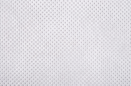织造用品白色的非织造的织物纹理照片