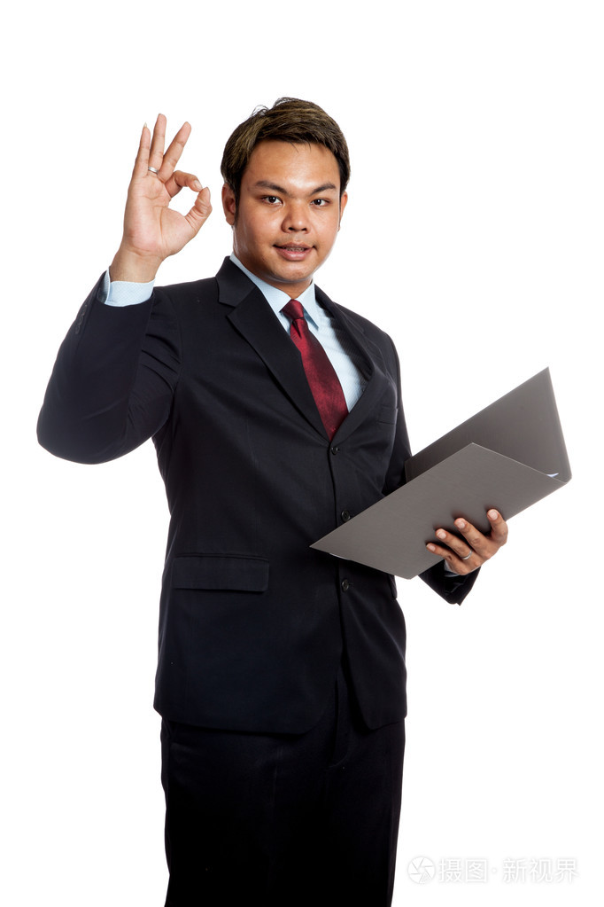 亚洲商人显示ok的手势一份报告