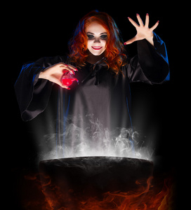 红药水年轻的女巫用红药水照片