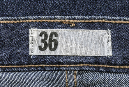 纺织标签上蓝色的牛仔裤背景