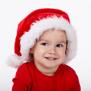 圣诞老人的帽子的小可爱男孩