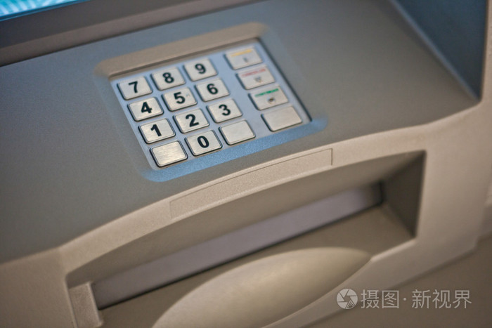 灰色和蓝色小键盘的自动取款机
