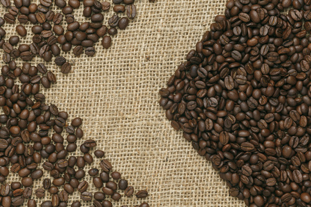 黄麻背景上的咖啡豆咖啡版图片