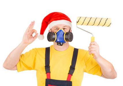 防毒面具和圣诞老人的帽子与滚子的工人