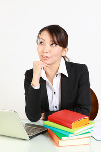 Japanese businesswoman dreaming at her future