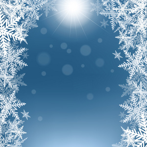 圣诞雪花和在蓝色背景上的太阳
