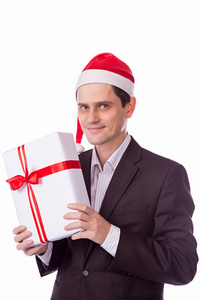 男人穿西装 帽子与圣诞礼物在白色背景上的手