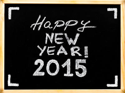 快乐新的一年到 2015 年，老式概念木框黑板上用粉笔写的手