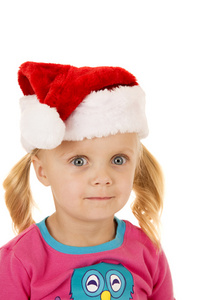 睁大眼睛的金发女孩 portriat 穿着圣诞老人的帽子