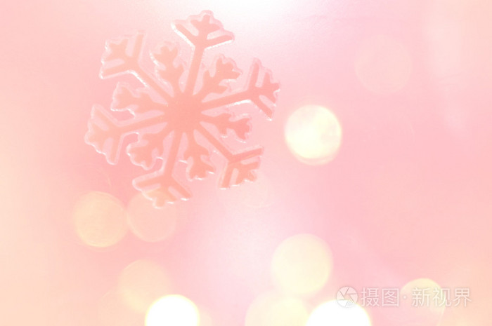 寒假里雪花背景,粉红色的散景