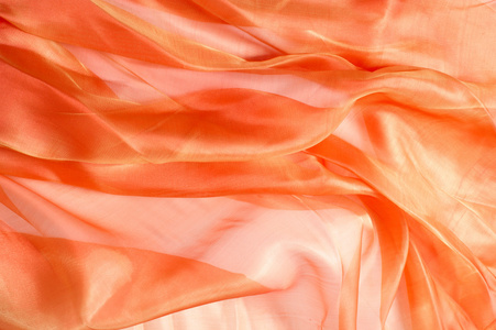 橙色织物纹理。从摄影棚里取出的纸巾
