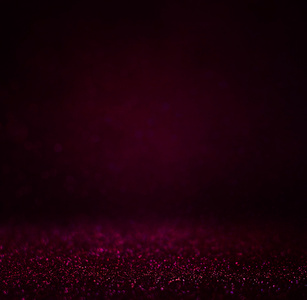 抽象的黑 bokhe 的灯光背景，紫色，黑色和微妙的黄金。离焦模糊的背景