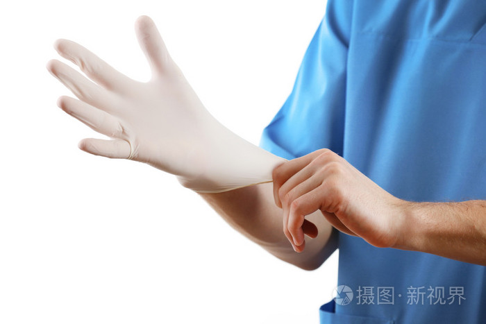 医生戴上无菌手套隔离在白色背景上
