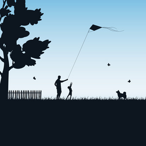 父亲和孩子玩风筝