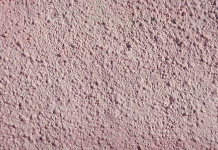 粉红色的装饰浮雕石膏墙上