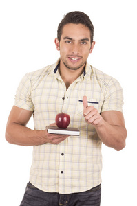 年轻快乐的男老师拿着笔记本和红苹果