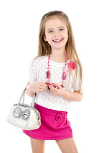 可爱微笑的小女孩，在与袋和珠裙子