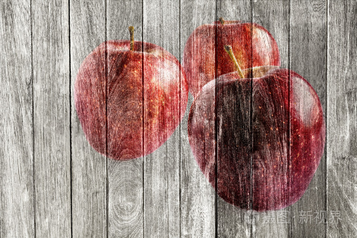 苹果在木制的背景上绘制纹理美观