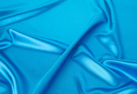蓝色丝绸软褶皱的布
