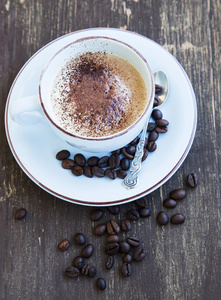 卡布奇诺杯咖啡的咖啡豆图片