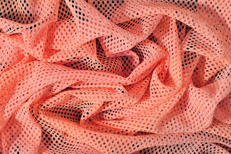 橙色皱巴巴的非织造的布背景