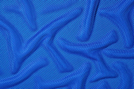 蓝色皱巴巴的非织造的布背景