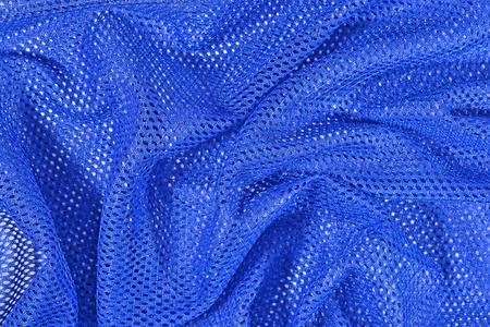 蓝色皱巴巴的非织造的布背景
