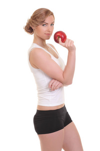 年轻的健身女人快乐微笑控股苹果